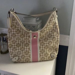 Brown and pink coach hobo style bag